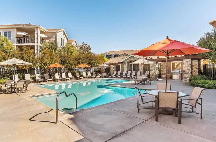 Pool amenity area at furnished corporate apartment building located in Santa Rosa, CA.