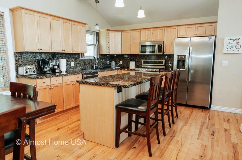 Fully equipped kitchen in furnished home located in Sandy Utah.