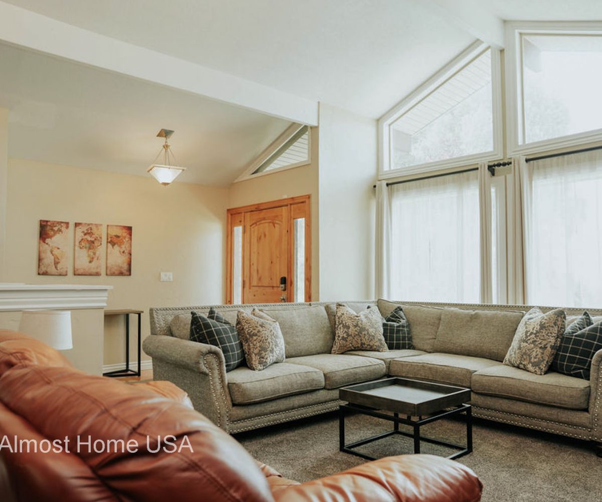 Large couch in furnished home located in Sandy Utah.
