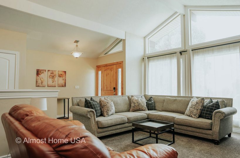 Large couch in furnished home located in Sandy Utah.