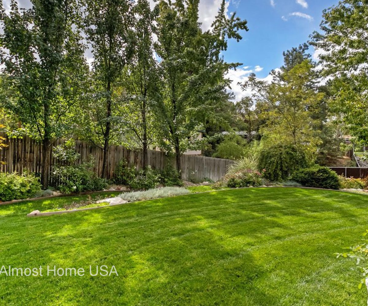 Large fenced in backyard at furnished home located in Sandy Utah.