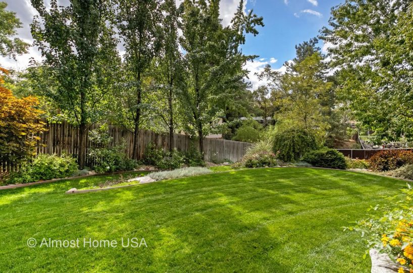 Large fenced in backyard at furnished home located in Sandy Utah.