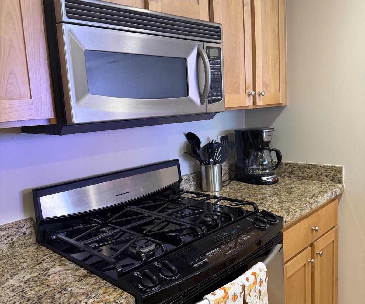 Fully equipped kitchen in furnished condo in Salt Lake City.