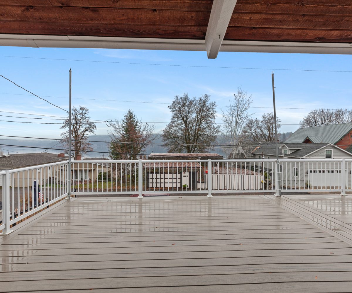 Deck attached to furnished home in Liberty Lake, WA with water views.
