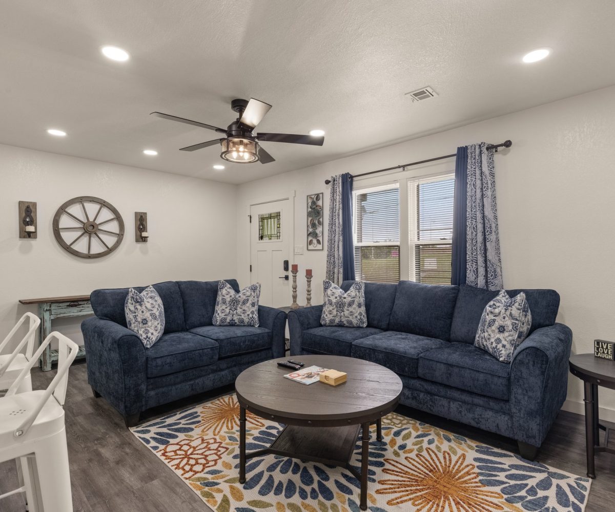 Seating area in furnished living room in furnished home in Tulsa, OK.