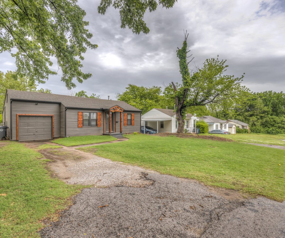 Exterior of driveway leading up to front entry of furnished home in Tulsa, OK.