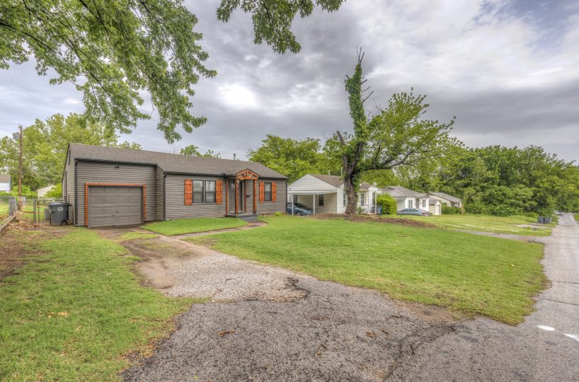 Exterior of driveway leading up to front entry of furnished home in Tulsa, OK.