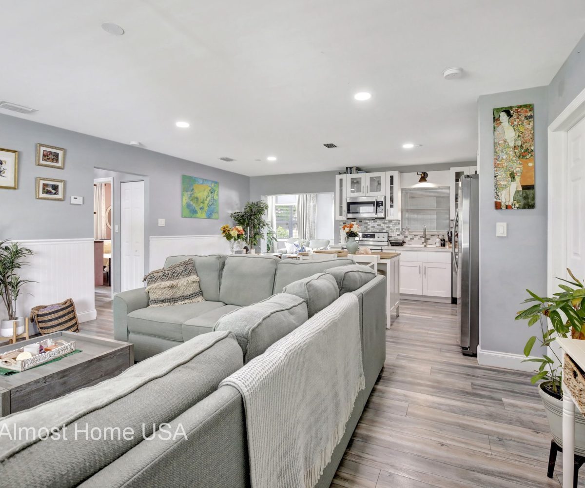 Large seating area in living room of furnished home located in Miami, FL.