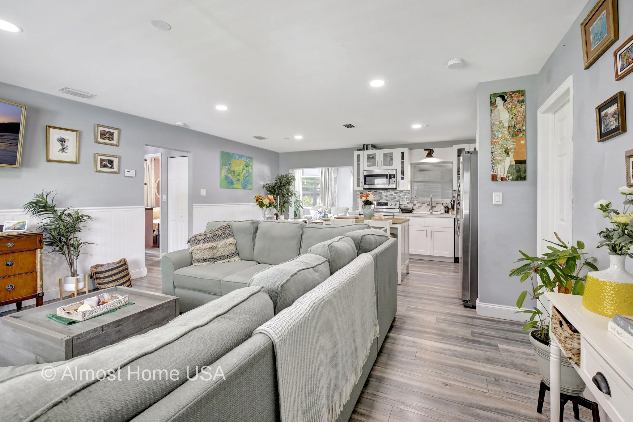 Large seating area in living room of furnished home located in Miami, FL.
