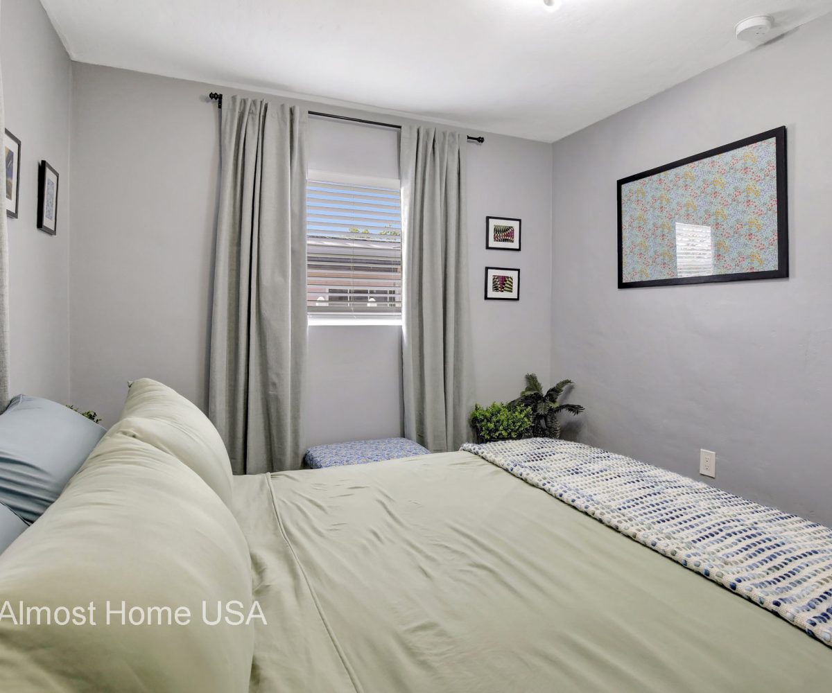 Queen bed in furnished home located in Miami, FL.