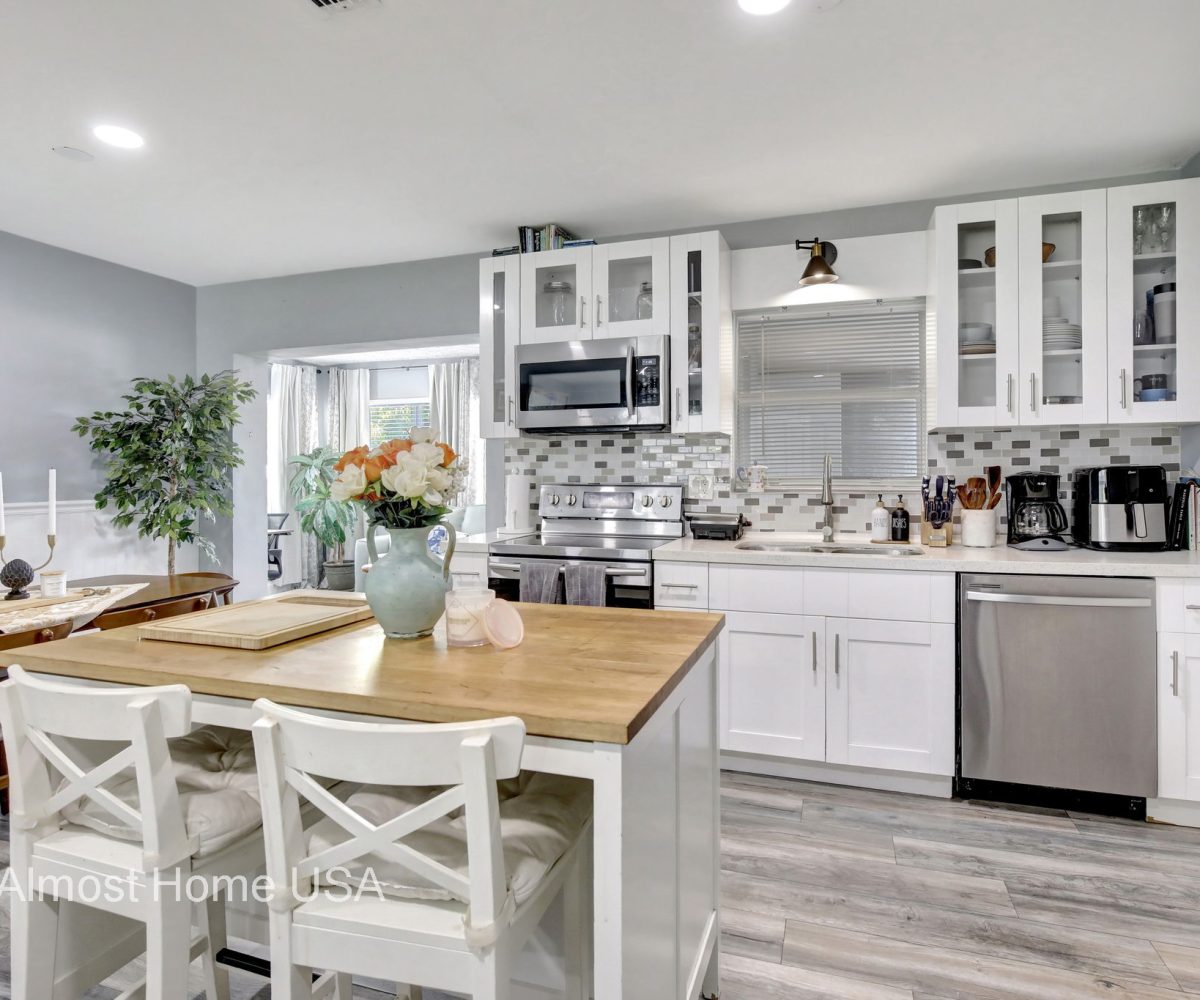 Fully equipped kitchen in furnished home located in Miami, FL.