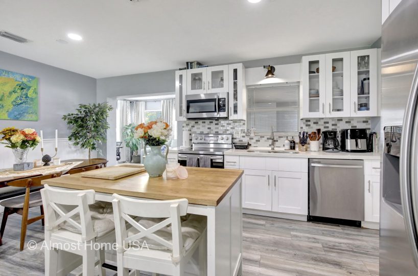 Fully equipped kitchen in furnished home located in Miami, FL.