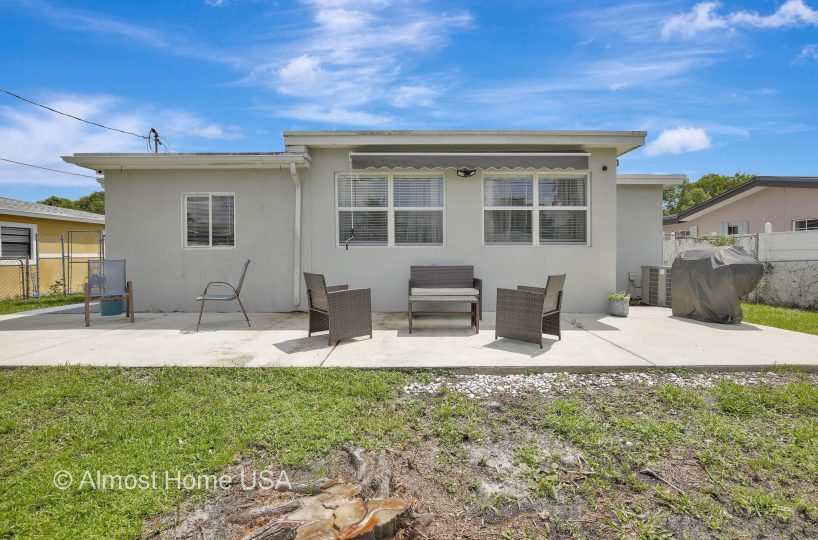 Back patio of furnished home located in Miami, FL.