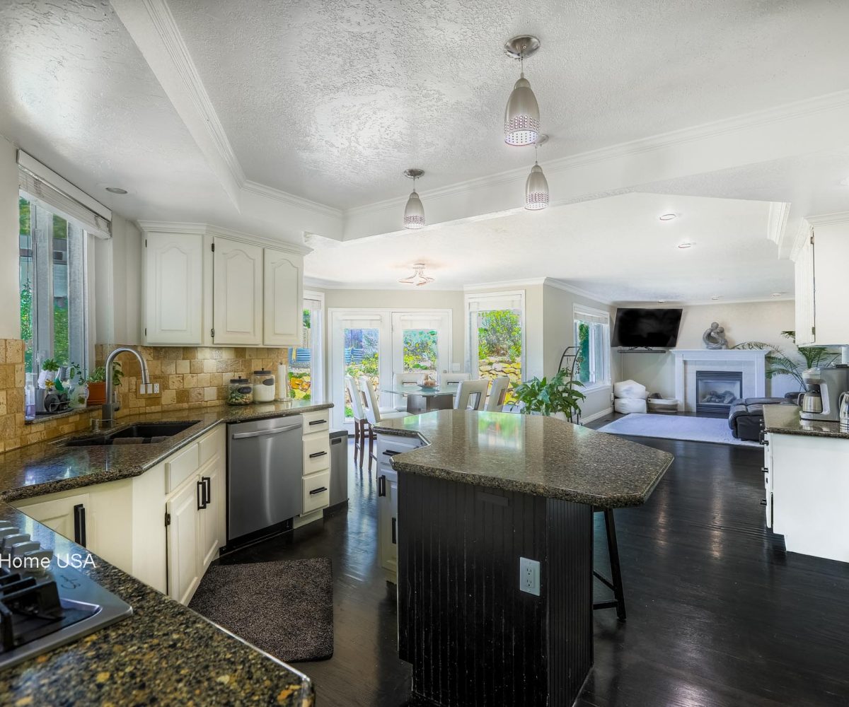 Kitchen and living area in furnished 5 bedroom home in Holladay, UT.