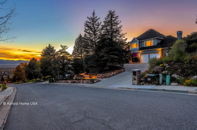 Front exterior and mountain view at furnished 5 bedroom home in Holladay, UT.