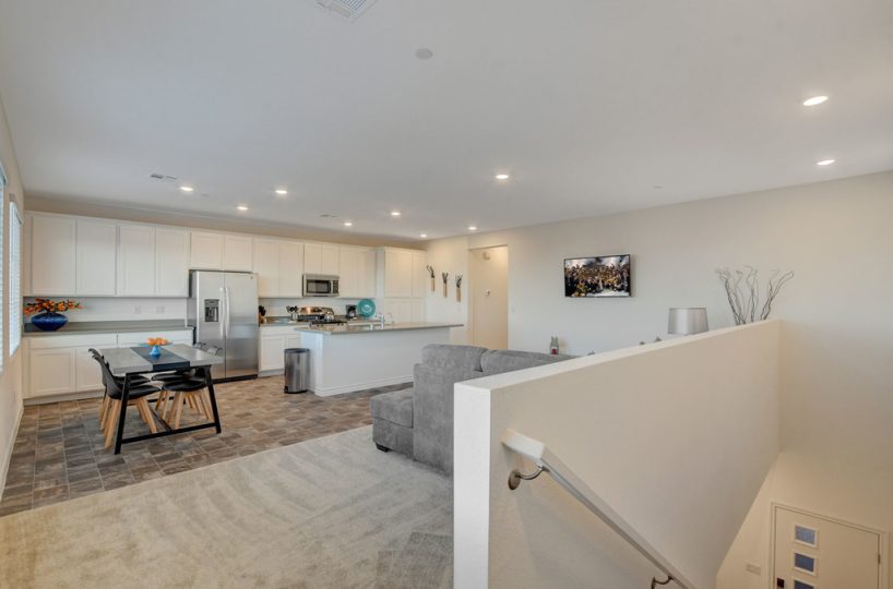 Open concept living room and kitchen in furnished townhome located in Henderson, NV.