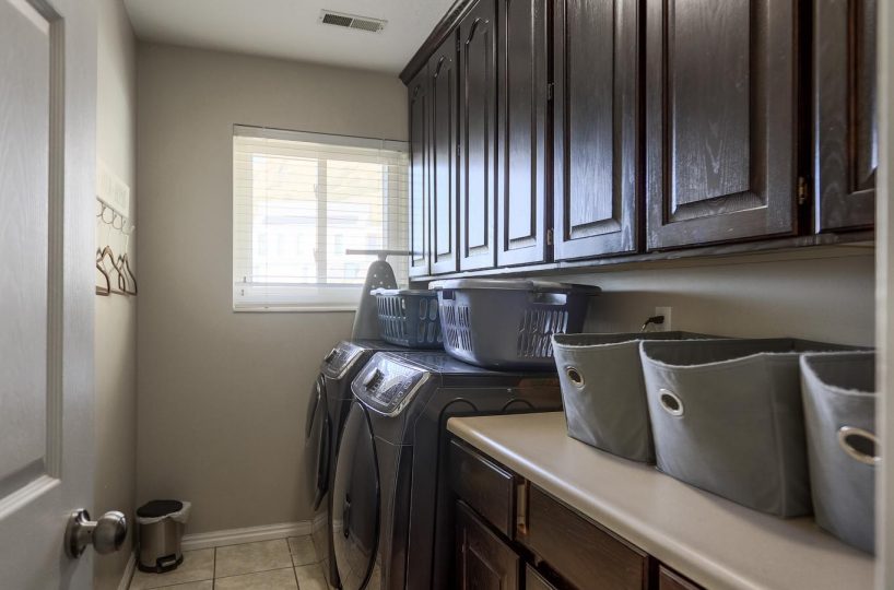 Laundry room in furnished five bedroom home in Holladay, UT.