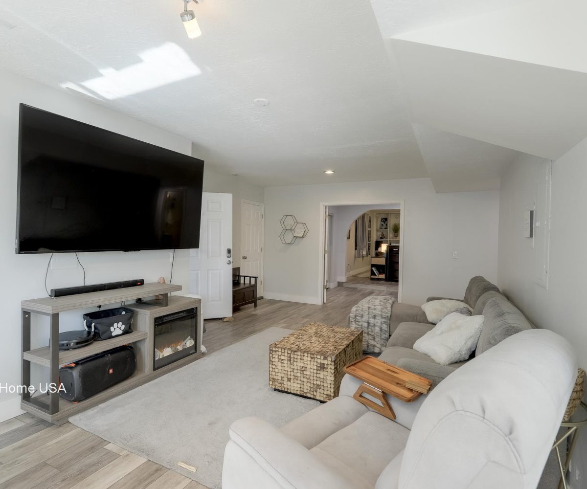 Downstairs family room in furnished 5 bedroom home in Holladay, UT.