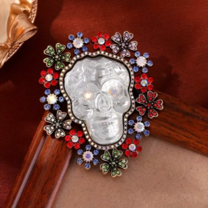 Large rhinestone skull flower brooch with colorful crystal accents