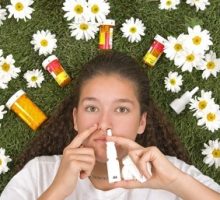 girl on grass with medicines for seasonal allergies