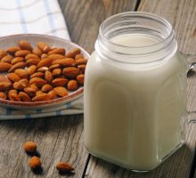 almonds and almond milk on table as part of dairy-free diet