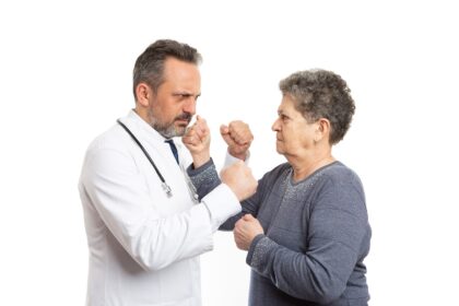 Angry doctor fights with older woman