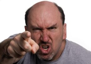 Very angry man pointing finger in anger