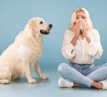 Woman with stuffy nose and severe allergies to dog sitting next to her