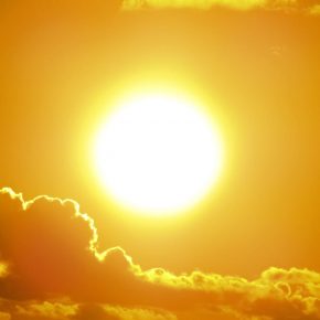 a bright sun blazing in the sky provides sunlight's health benefits