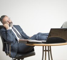 business man sleeping at desk