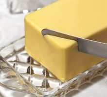 Butter in crystal butter dish with knife