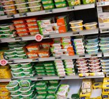 Refrigerated shelves of butter and margarine at a supermarket