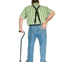 man walking with a cane and holding his lower back