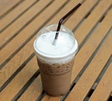cold drink chocolate frappuccino in takeaway cup
