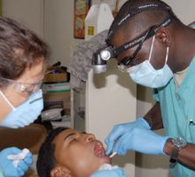 Dentist working on a patient, gums