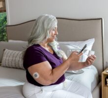 A woman wearing new OTC Stelo continuous glucose monitor.