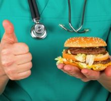 doctor holding burger