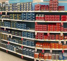 drugstore shelves with over the counter (OTC) pain relief products.