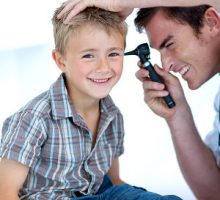 Boy gets an ear exam