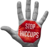 Stop Hiccups - Red Sign Painted on an Open Hand Raised