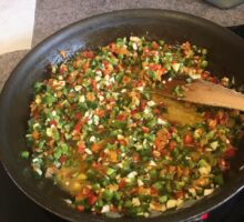 Condiment made with hot peppers and garlic in frying pan