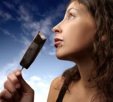 young woman enjoying an ice cream bar