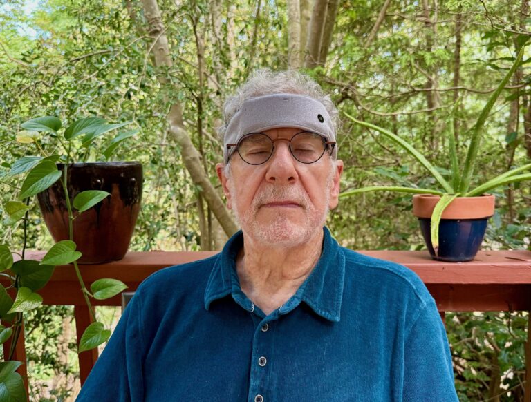 Man in blue shirt wears Sonu headband
