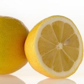 two lemons, one is cut