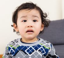 upset toddler suffering from gastroenteritis