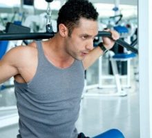 man lifting weights and exercising