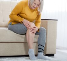 woman suffering from knee pain