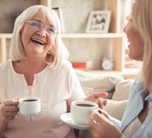 mother and daughter enjoying a cup of coffee together