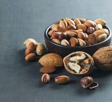 nuts in a bowl to control cholesterol naturally