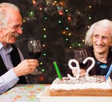 Older people toasting at a birthday celebration